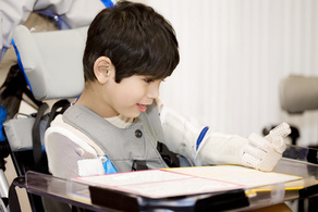 disabled five year old boy studying